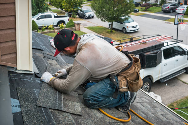 Professional Roofing technician working in North Bend, OR